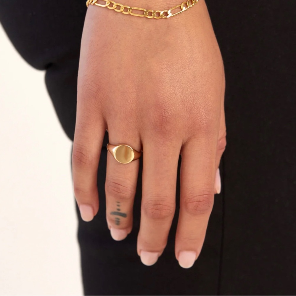 Ougie gold 14 k gold signet ring.